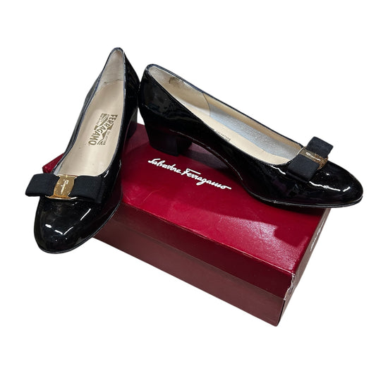 1980s Salvatore Ferragamo Black Patent Leather Gold Bow Pumps W 10